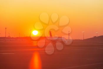 Aircraft in airport at sunrise