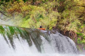 Kayaker jumping from the waterfall in Mexico