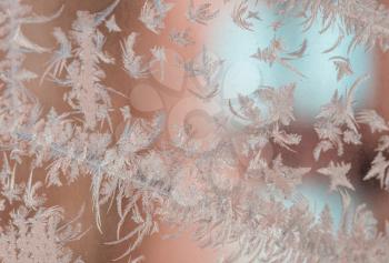 Frozen window. Crystals on a frozen window. Christmas background.