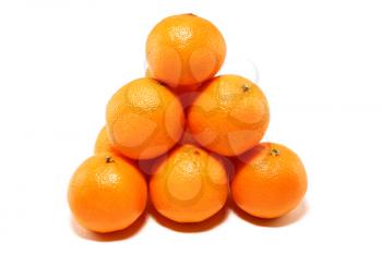 Small group of ripe tangerines on a white background