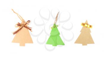 Three christmas tree made of old paper with a small bow and space for Your text