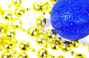 Blue Christmas ball with a many small golden balls.