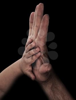 baby hand with father's hand