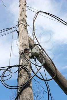 wooden pole with wires