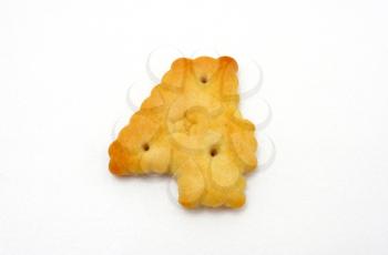 Yellow cookies in the form of figures on a white background