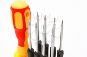 Set of screw-drivers with the orange handle on a white background