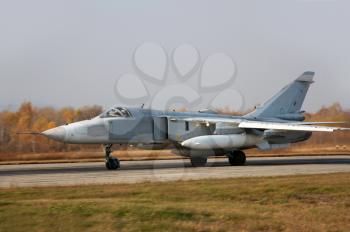 Military jet bomber airplane Su-24 Fencer on take off and landing