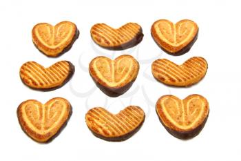 Cookies in the form of heart with chocolate on a white background
