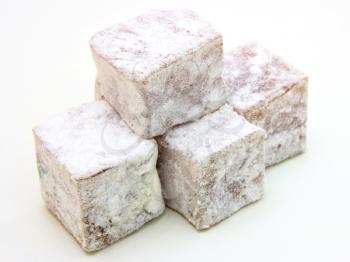 Turkish delight (lokum) confection on a white background