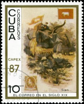 CUBA - CIRCA 1987: A stamp printed in the Cuba, shows traditional old vehicles. Siamese elephants, circa 1987