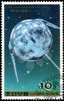 DEMOCRATIC PEOPLE'S REPUBLIC (DPR) of KOREA - CIRCA 1987:A stamp printed in DPR Korea (North Korea) shows  30 anniversary of the first flight satellite, Sputnik-1 1957 , circa 1987
