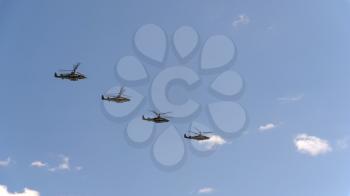 MOSCOW - MAY 7: combat helicopters Ka-52 fly in sky on training parade in honor of Great Patriotic War victory on May 7, 2017 in Moscow, Russia.