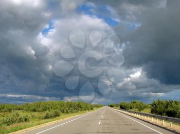 Most asphalt road,  against the background of clouds
