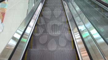 Moving escalator up in a public area.