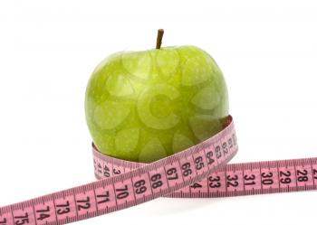 Apple with tape measure isolated on white background. Healthy lifestyle concept.