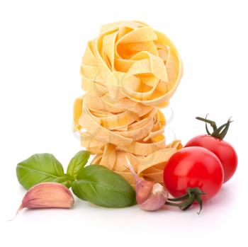 Italian pasta fettuccine nest  and cherry tomato isolated on white background