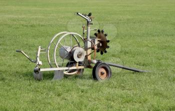 Royalty Free Photo of a Mobile Sport Field Irrigation System with Pipe Spindle 
