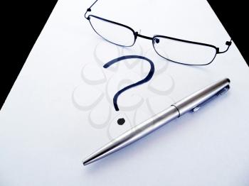 Royalty Free Photo of Glasses and a Pen on Paper