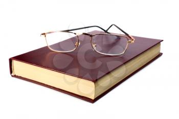 book and glasses isolated on white background