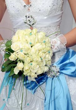 bride and wedding bouquet  from white roses