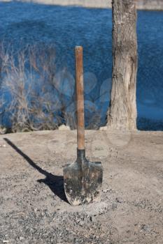 shovel stuck in the ground