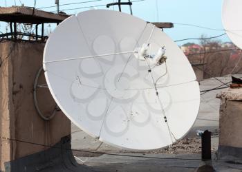 Satellite dish with sky on roof 