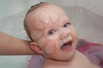 Sweet baby in bath, laughing 