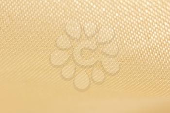 golden fabric as a background. macro