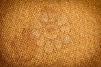 Background of golden fabric with stains. texture