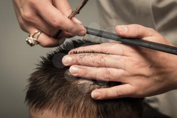 Men's haircut at the barber scissors