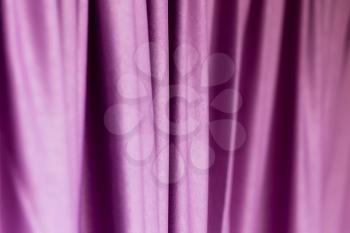 Purple cloth on the curtain as a background .