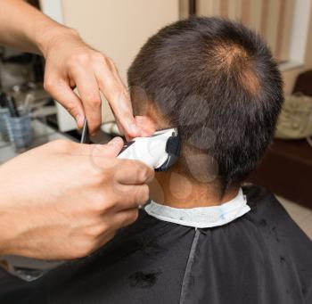 Fashionable men's haircut in a beauty salon .