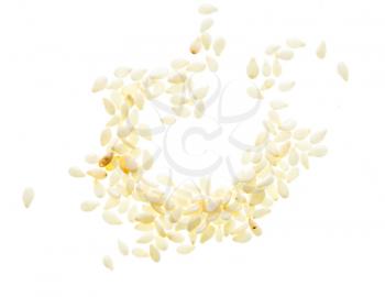 Sesame seeds scattered and isolated on white background