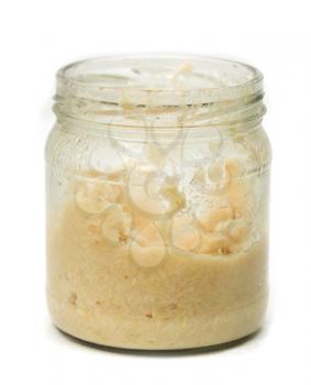 Horseradish white sauce in glass bowl isolated on white
