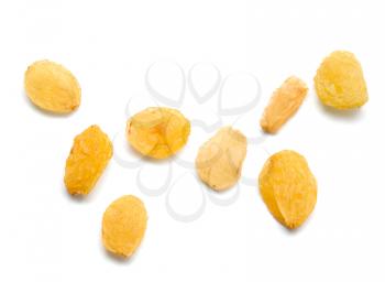 yellow raisins on a white background. macro