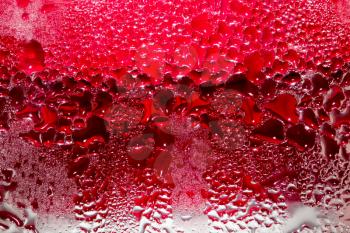 Abstract background of water drops on a red background