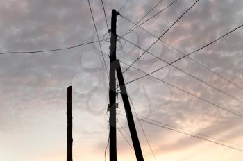 electric pole with wires at sunset