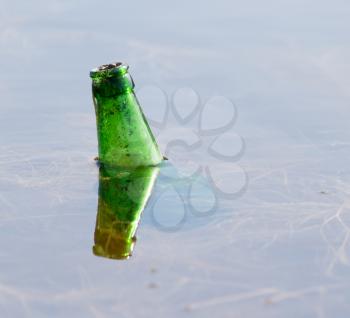 bottle of water in the lake