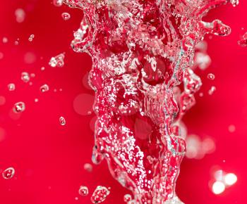 spray water on red background