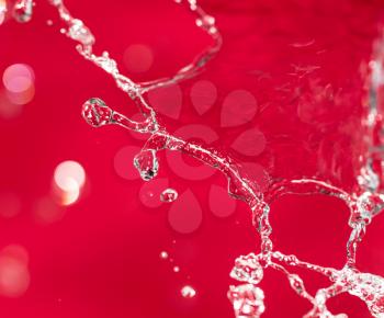 spray water on the red background