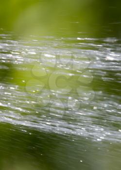 splashing water on nature. background