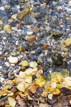 colored stones under water as background