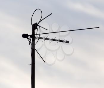 Antenna against the sky dawn sun