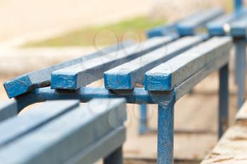 blue wooden bench in a park on the nature