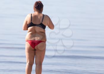 fat woman on the beach