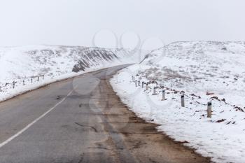 asphalt road on nature in winter