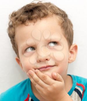 portrait of a boy's face contorts