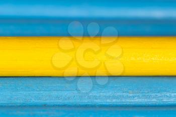 yellow and blue pencils as background