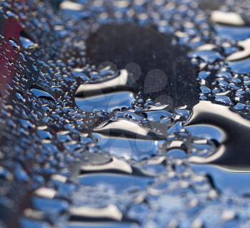 drops of water on a dark car