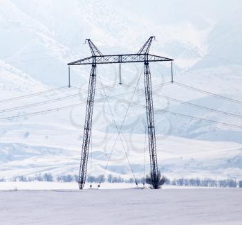 electric pole in the snow in the winter